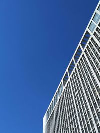 Low angle view of building against clear blue sky