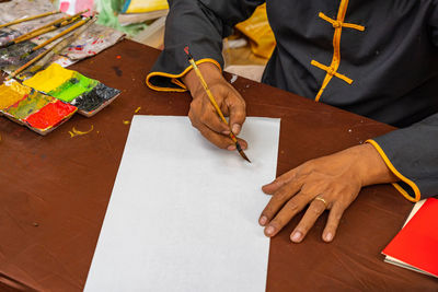 High angle view of man working on table