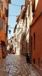 Narrow alley amidst buildings in city