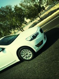 Close-up of car on road