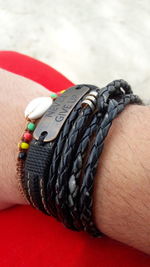 Close-up of man wearing bracelets