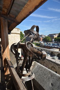 Close-up of sculpture in city against sky