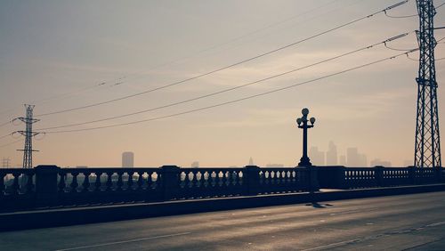 View of street light against sky at sunset