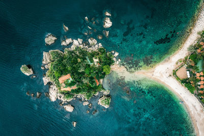 High angle view of rocks by sea