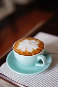 High angle view of coffee cup on table