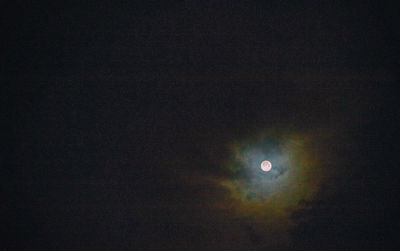 Low angle view of moon against sky at night