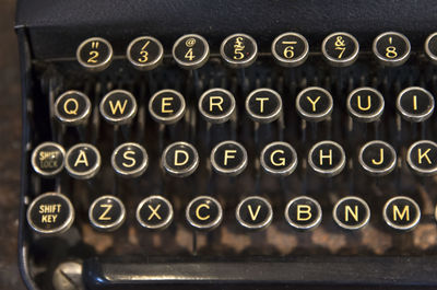 Close-up of old typewriter on table