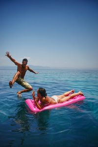 Man jumping in sea