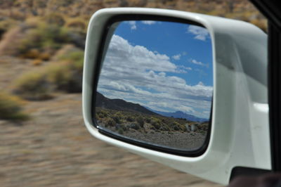 Cropped image of car on landscape