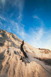 Happy woman enjoying life and freedom outdoor at sunset