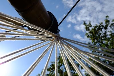 Low angle view of metallic structure against sky