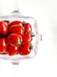 Close-up of tomatoes against white background