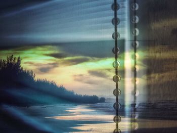 Close-up of sea against sky during sunset