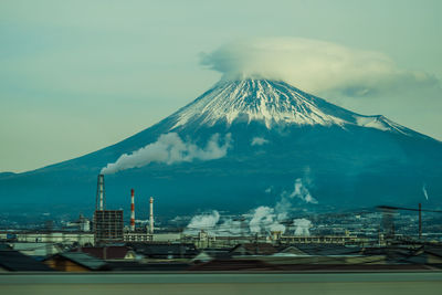 Panoramic view of factory against sky