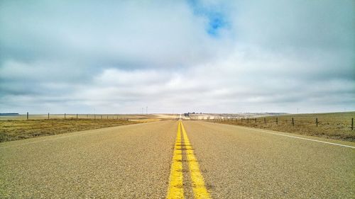 Road amidst landscape against sky