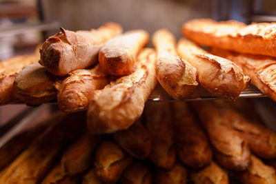 Freshly baked organic baguettes in bakery