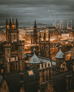 High angle view of illuminated buildings in city