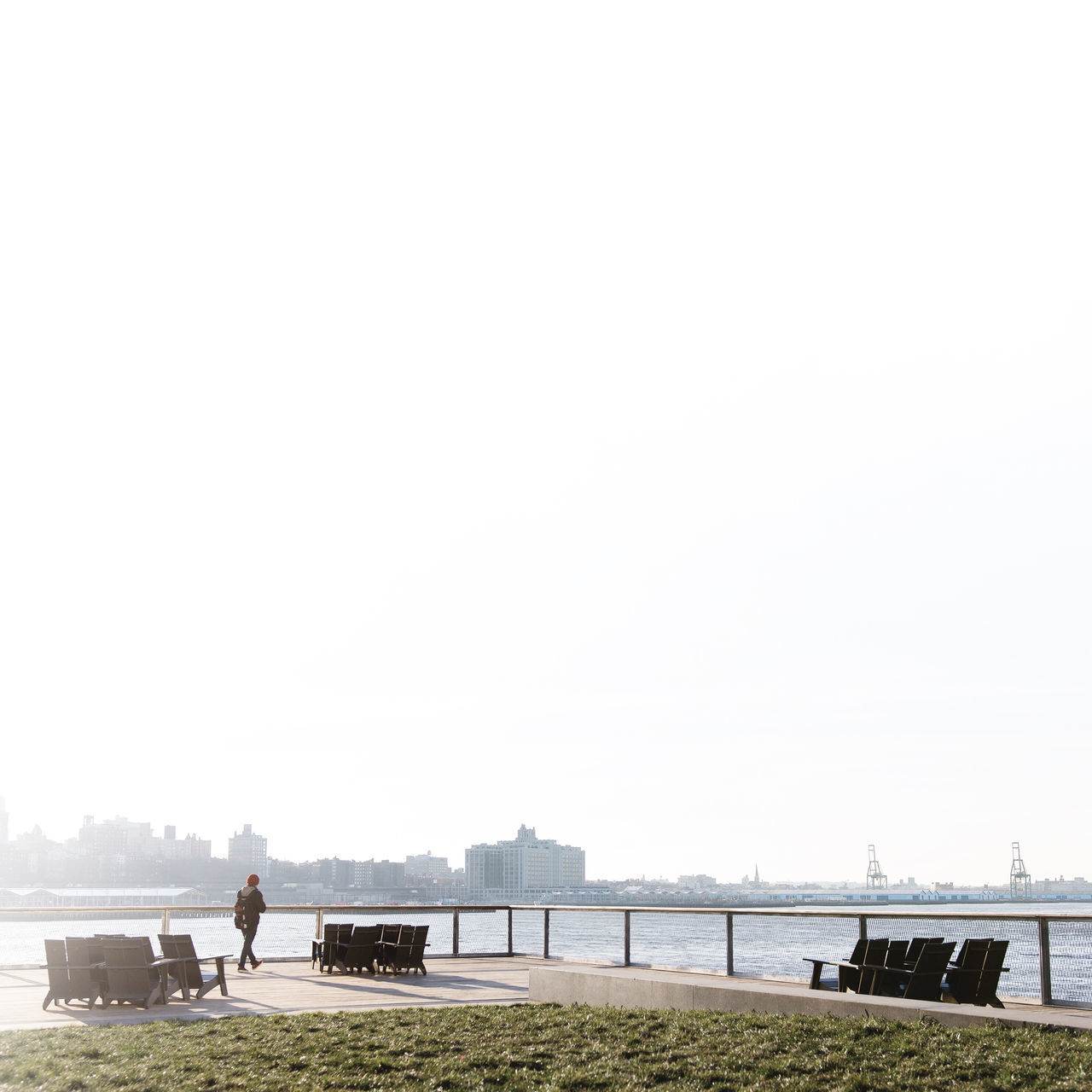 water, copy space, clear sky, railing, men, lifestyles, leisure activity, tranquility, sea, person, tranquil scene, river, nature, bridge - man made structure, built structure, scenics, sky, beauty in nature