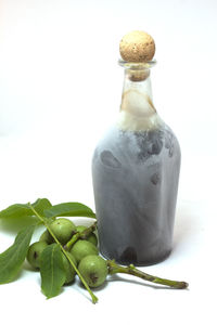 Close-up of drink against white background