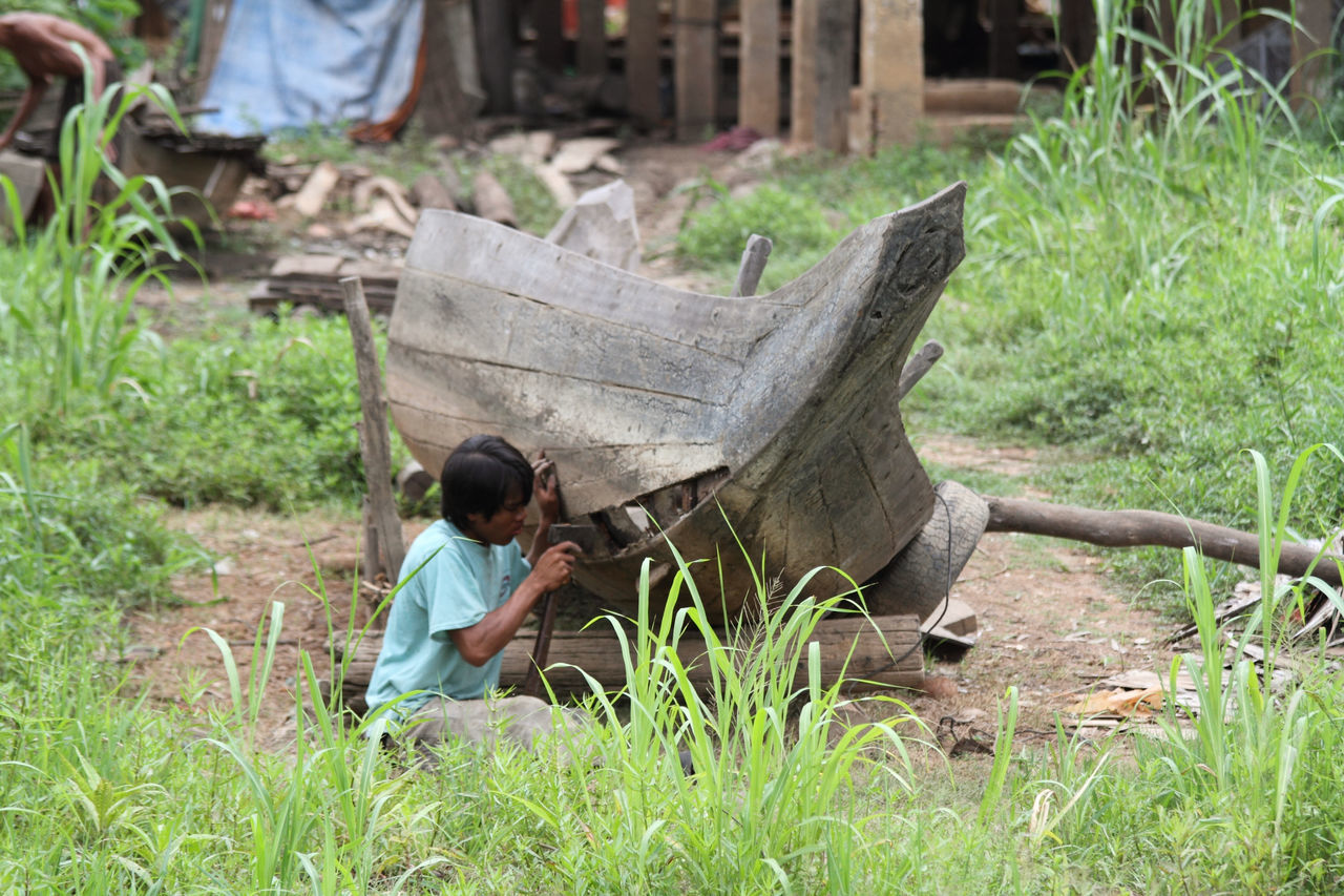 Man repairing a boat