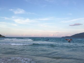 Colourful sky of dusk creeping in above the magnificent sea