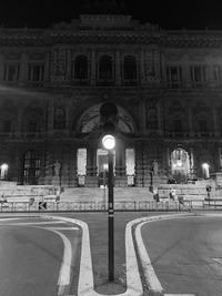 Illuminated building in city at night