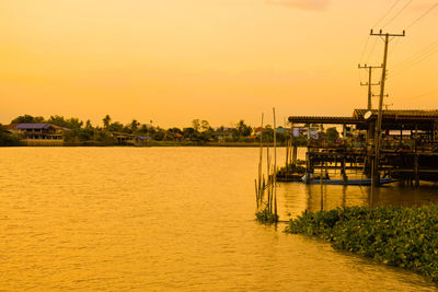 Scenic view of sea against orange sky