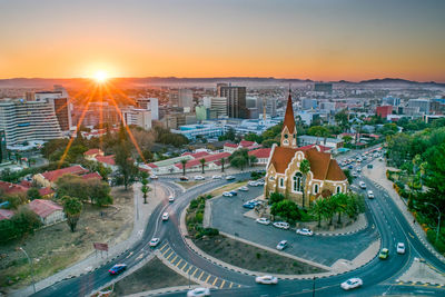 High angle view of city street against sky during sunset