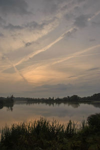 Scenic view of landscape against sky at sunset