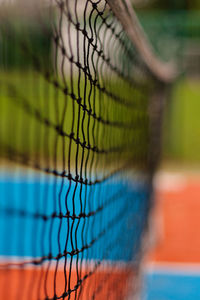 Close-up of net at tennis court