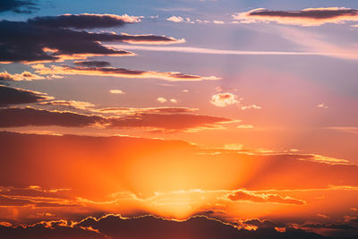 Low angle view of dramatic sky during sunset