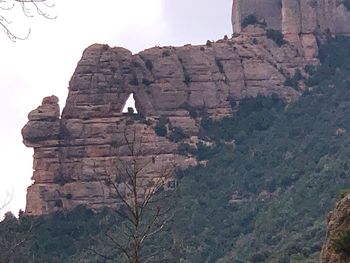Low angle view of rock formations on mountain
