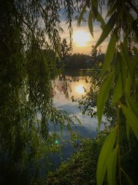 Scenic view of lake against sky during sunset