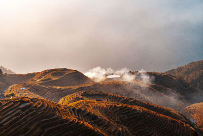 Scenic view of volcanic mountain against sky