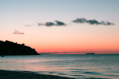 Scenic view of sea against sky at sunset