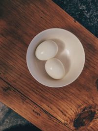 High angle view of eggs in plate on table