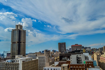 Modern buildings in city against sky