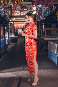 Portrait of young woman standing outdoors