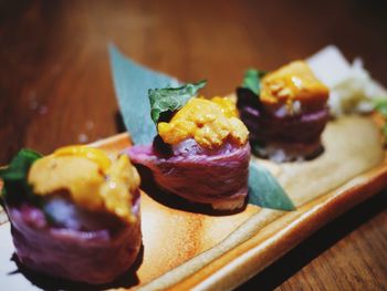 Close-up of sushi served on table