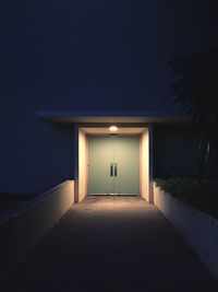 Illuminated doorway at night