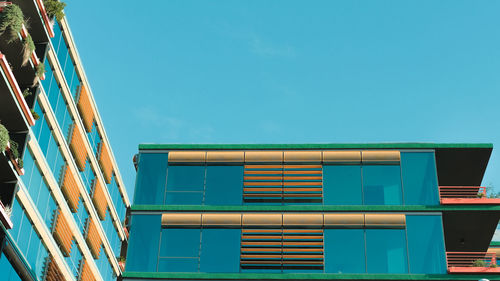 Low angle view of building against blue sky