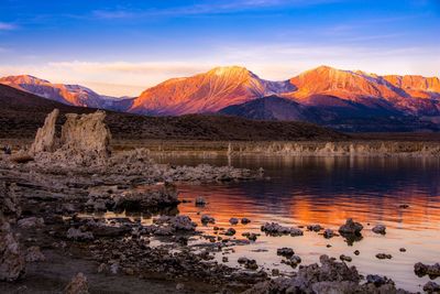 Scenic view of mono lake and mountains against sky during sunrise