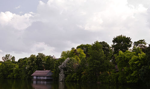 House by trees against sky