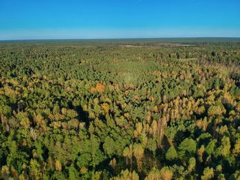 Scenic view of land against blue sky