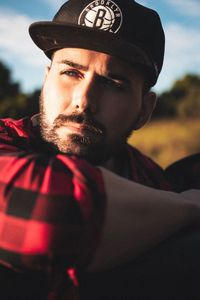Portrait of young man wearing hat