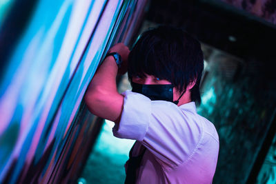 Rear view of man photographing