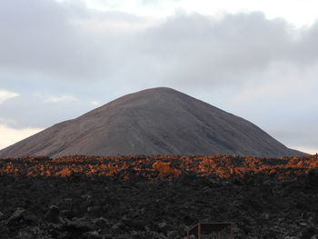 Scenic view of volcanic mountain against sky