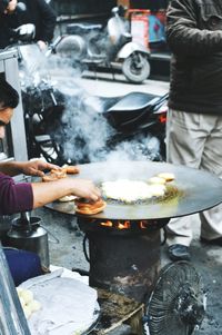 Cropped person selling food