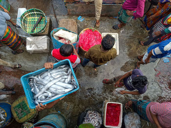 High angle view of people at fish market in chittagong bangladesh 