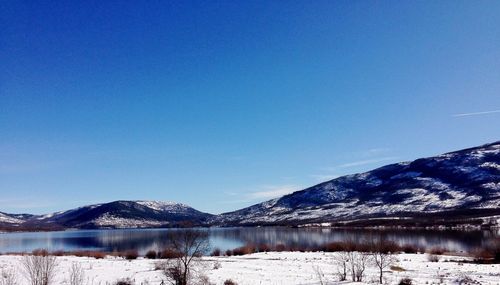 Scenic view of snow covered mountains